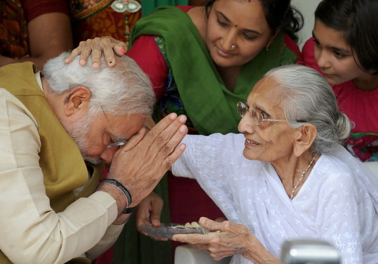 narendra modi seeks blessings of his mother