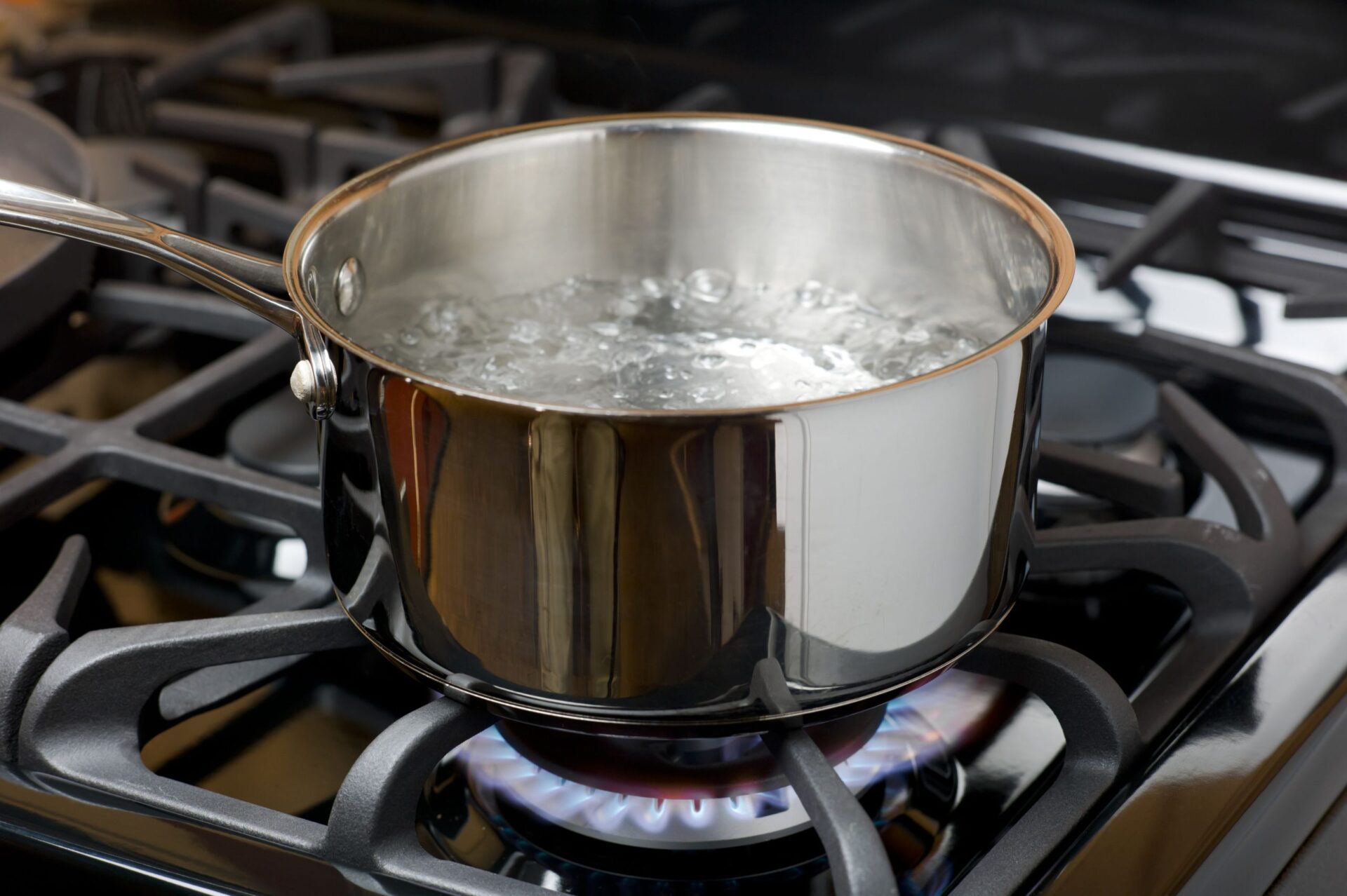 water boiling on a gas stove stainless pot royalty free image 155146092 1532961037 scaled