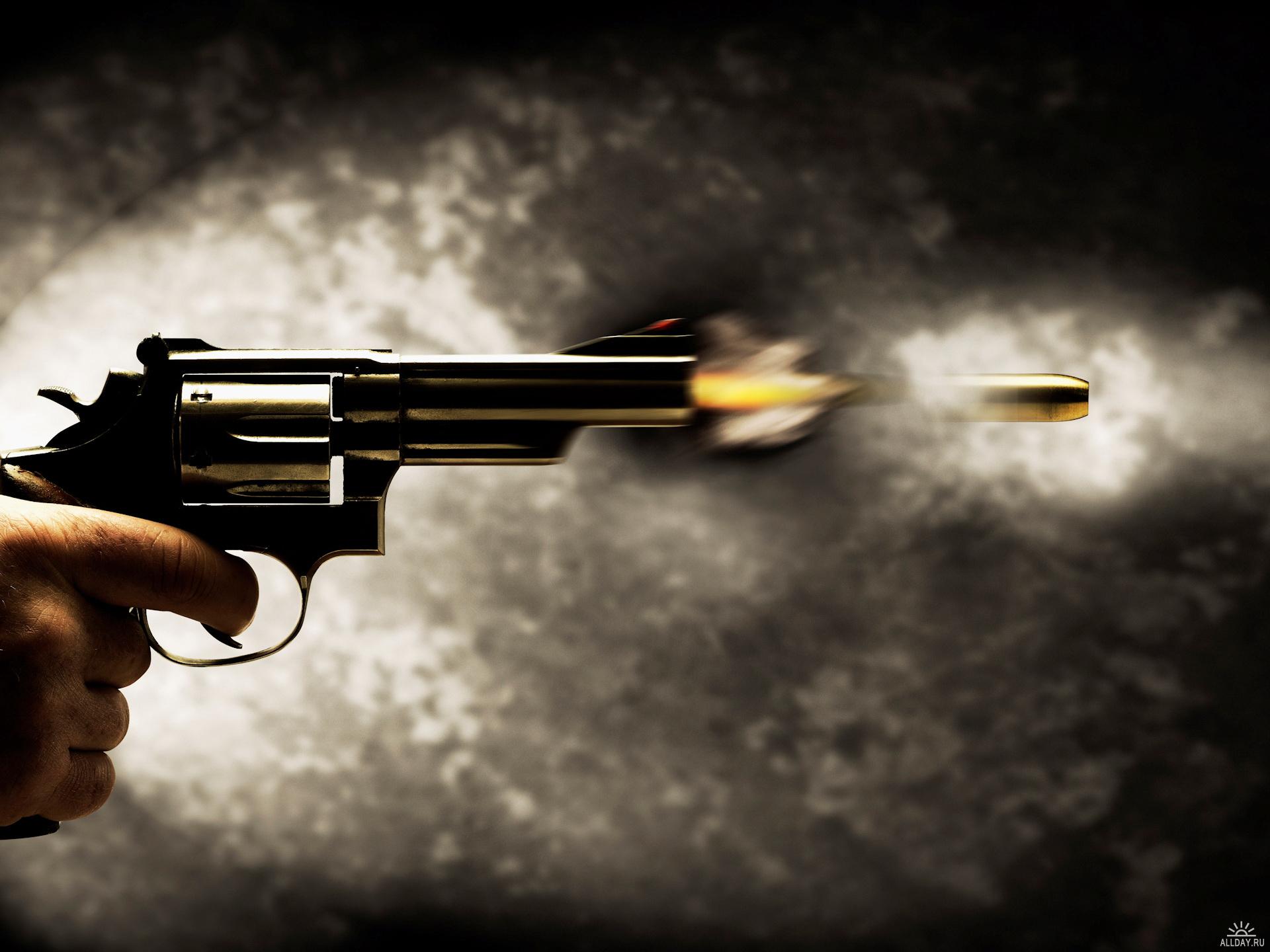 revolver firing bullet