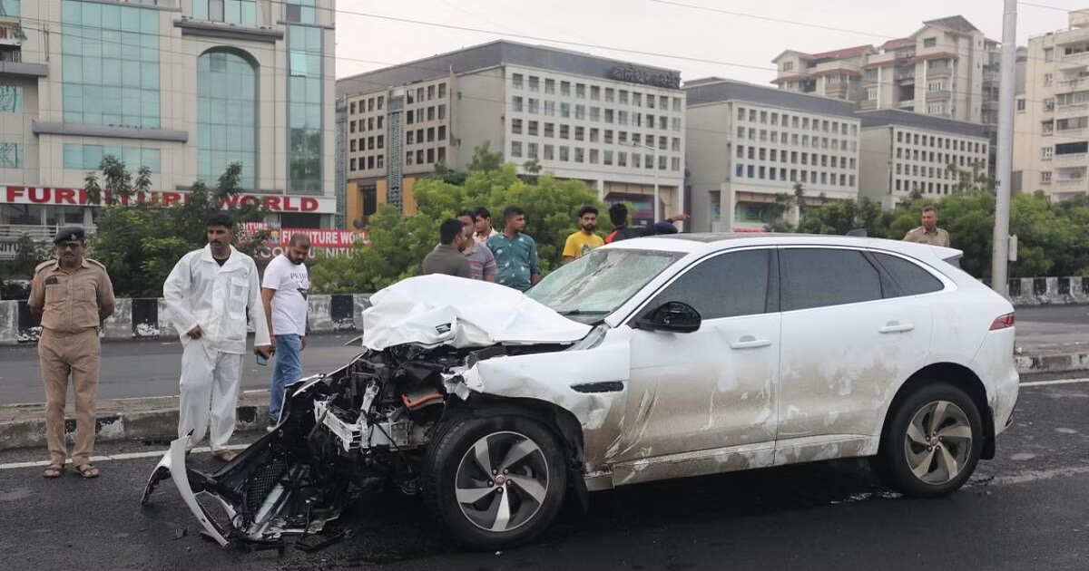 ahmedabad high speed audi car hits bike two people injured4123